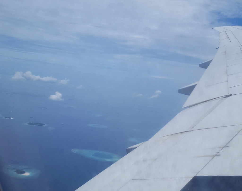 Atolls below us as we near Male